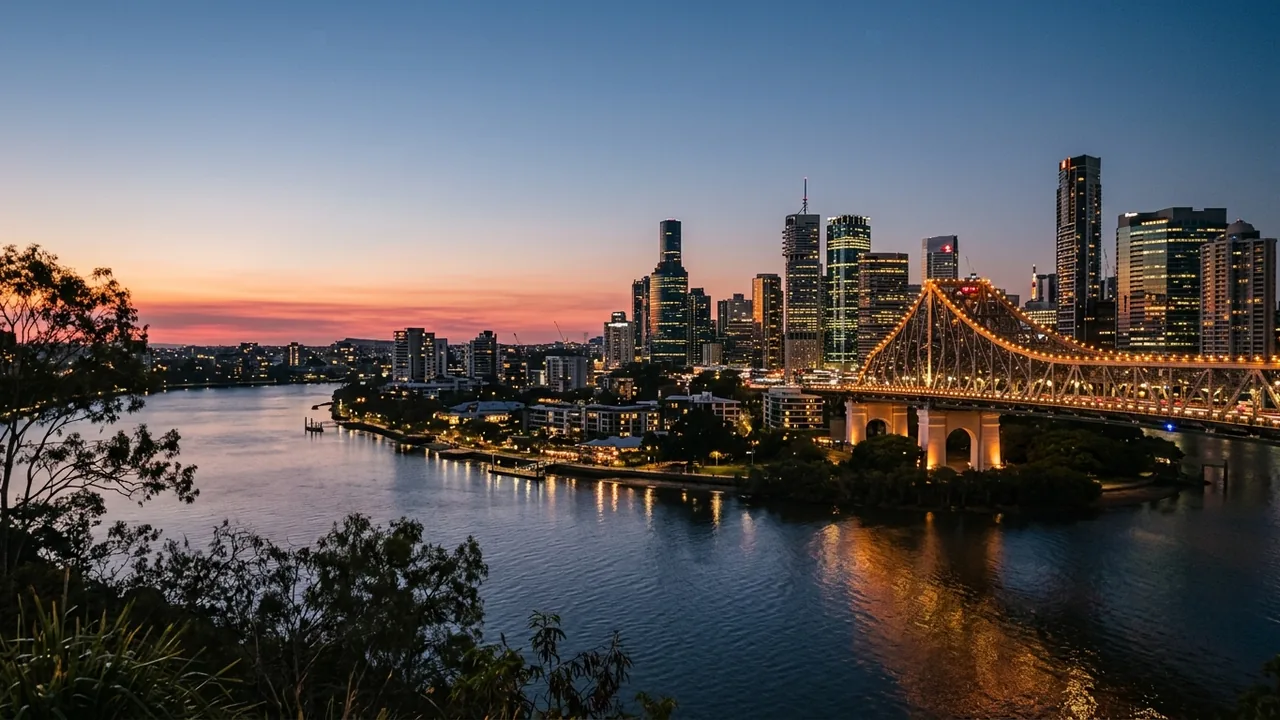 Dusk view over the Brisbane River and city skyline on a warm November Friday evening, hotel windows lit